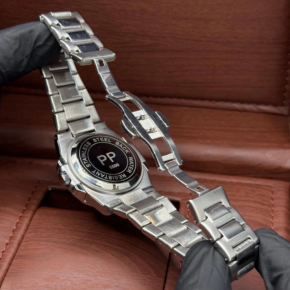 Patek Philippe silver with green dial with date