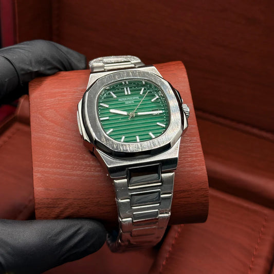 Patek Philippe silver with green dial with date